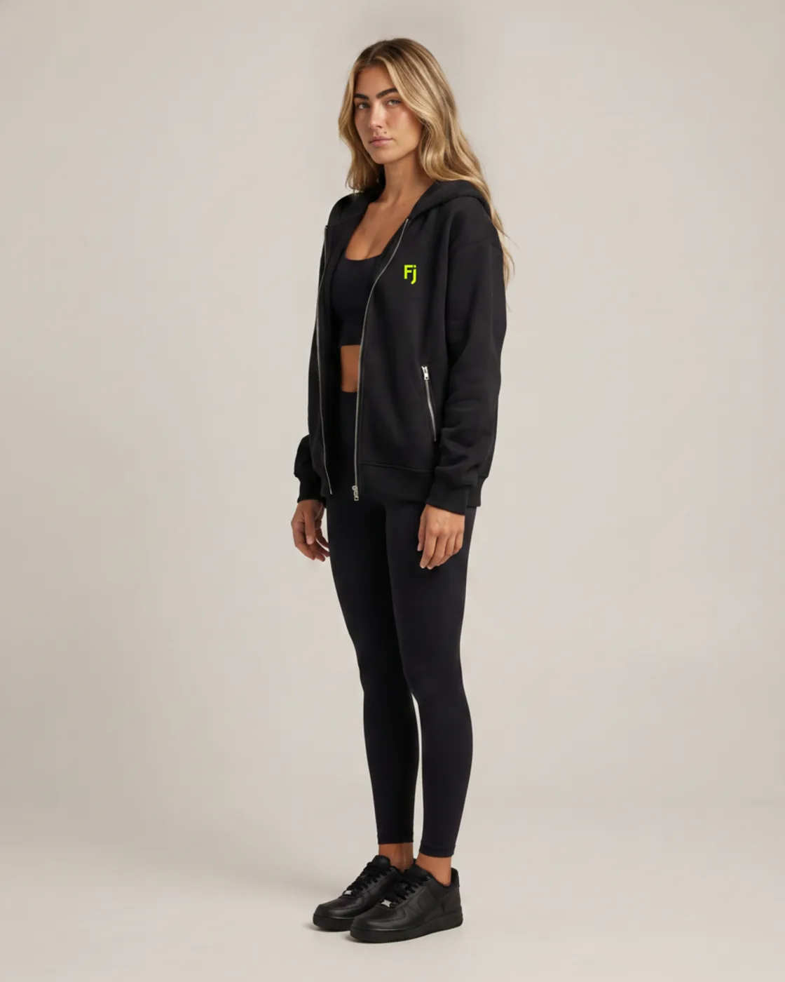 Forjium zip hoodie in a studio photograph