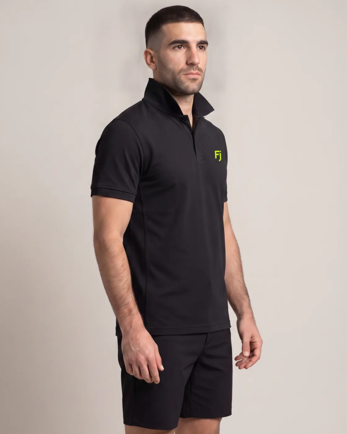Forjium tech polo in a studio photograph
